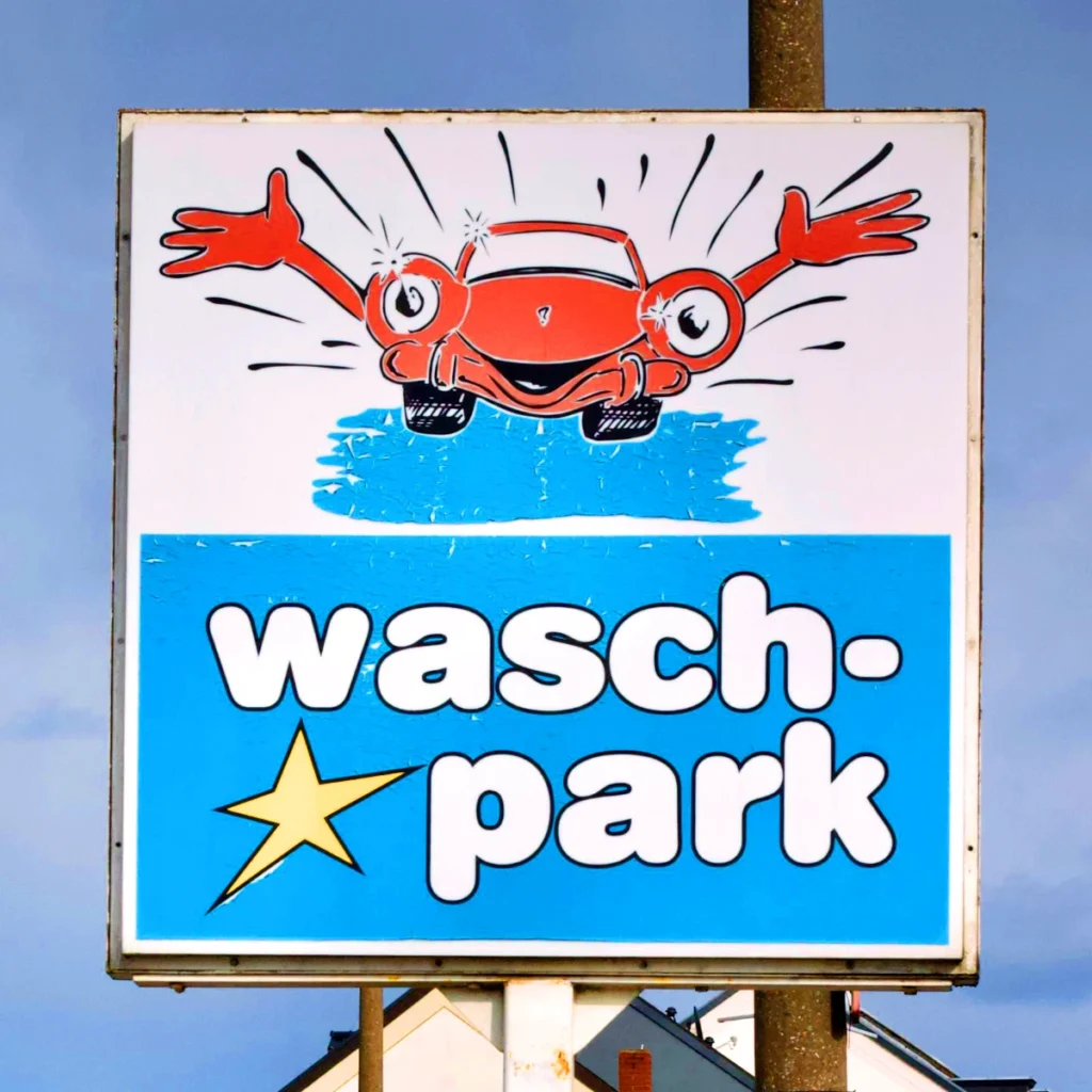 Local car wash logo on a street sign